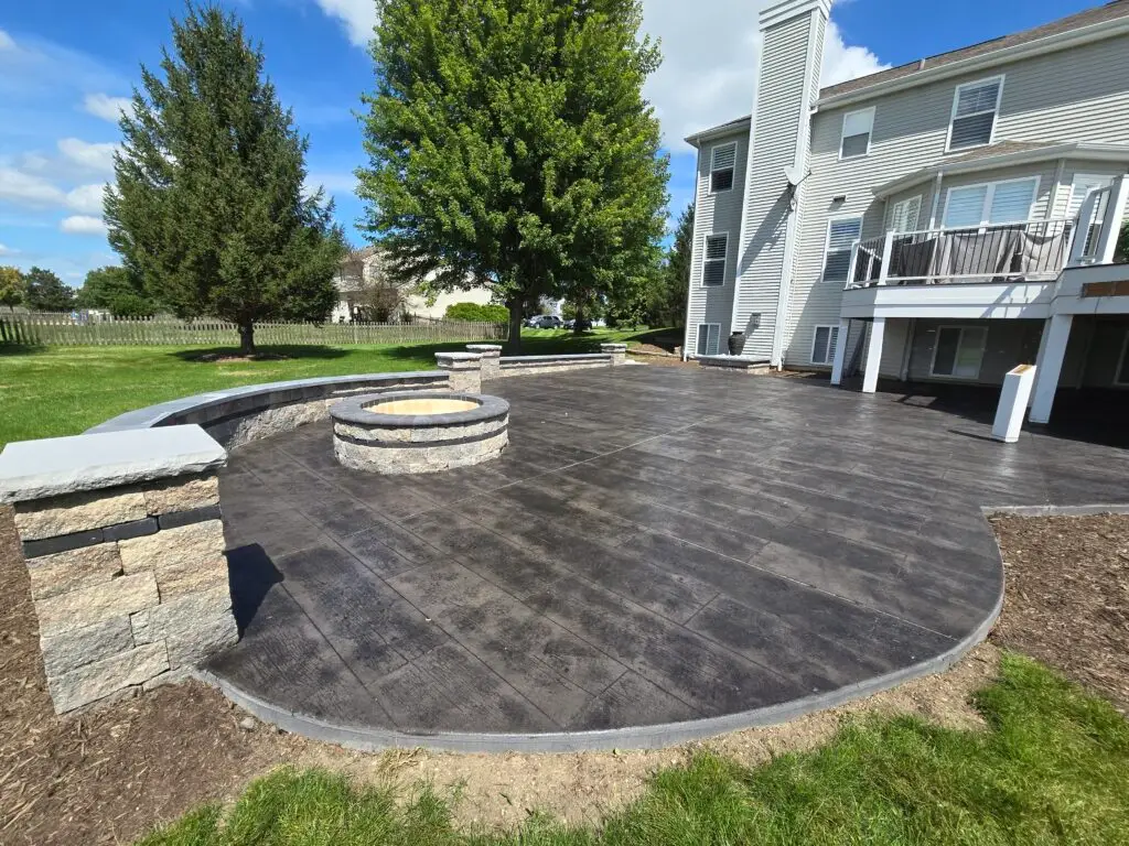 A custom fire pit design featuring a contemporary rectangular smokeless insert and a surrounding bluestone patio for year-round entertaining.